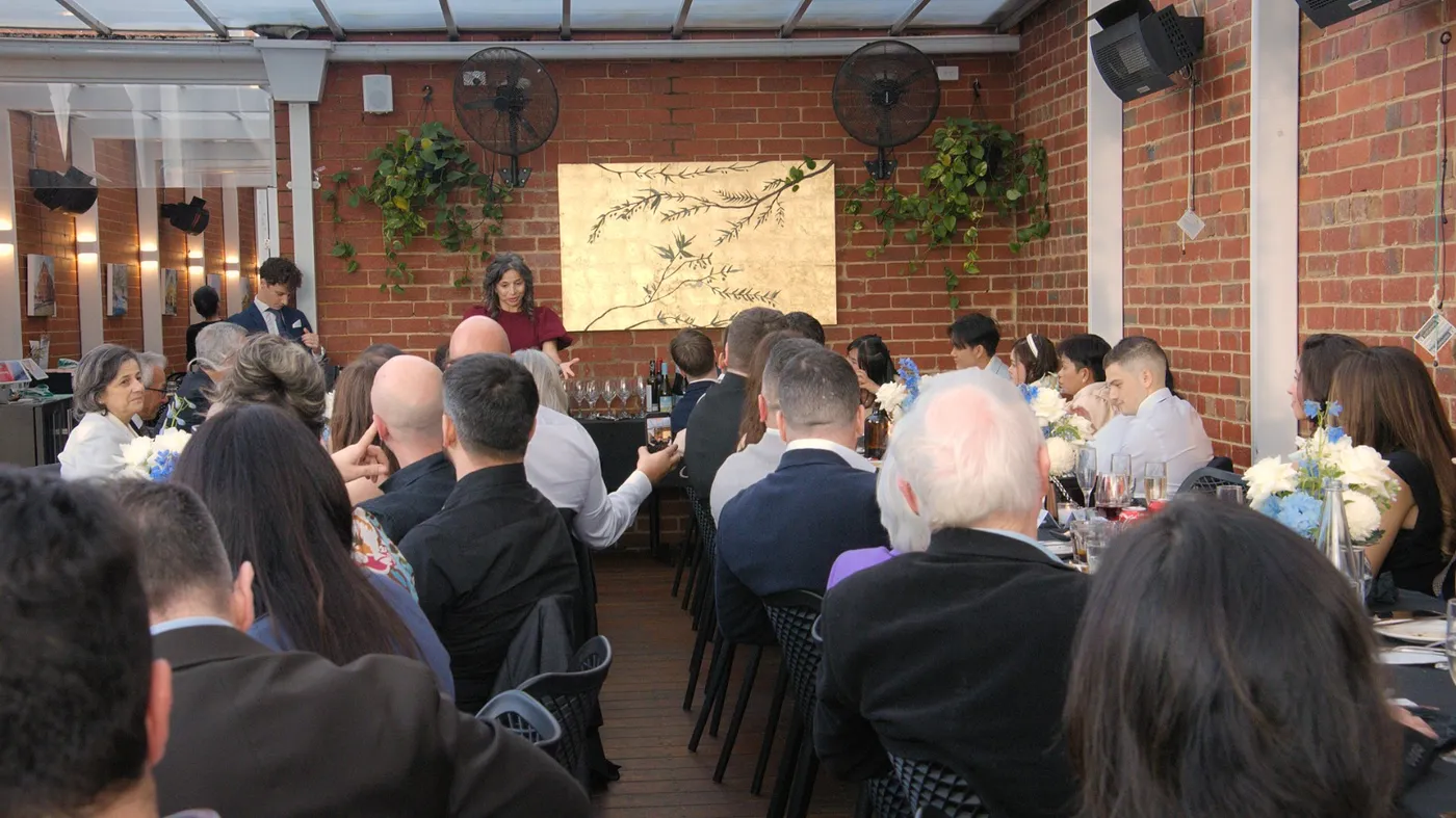 Wide view of the private dining room set up for an Olive Lane event