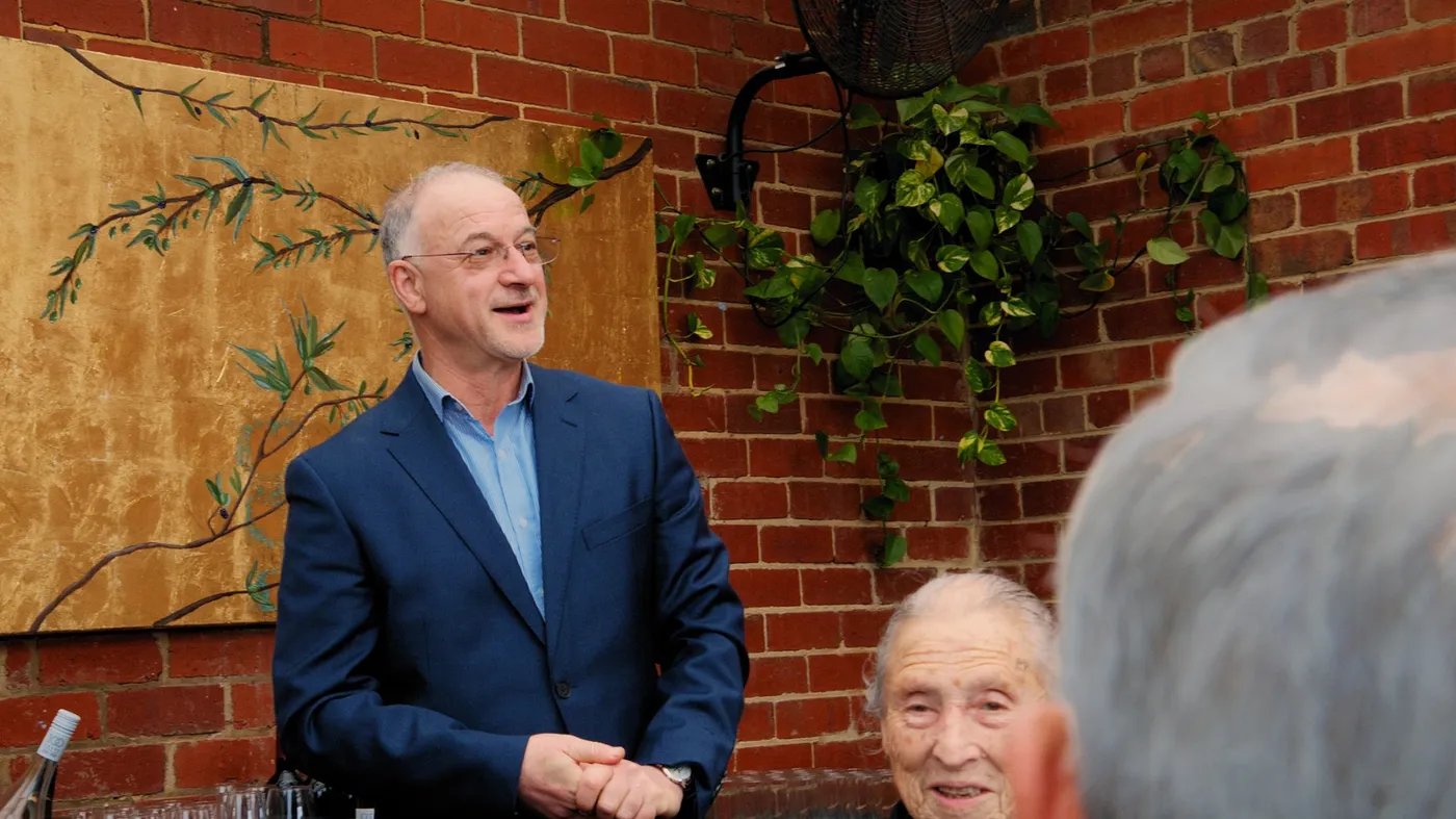 Guest smiling at an Olive Lane private event