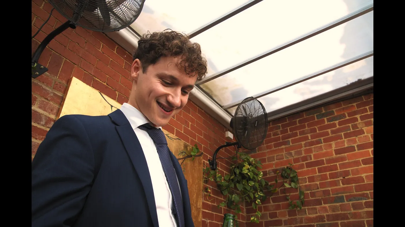 Guest smiling while giving a speech at an Olive Lane private event