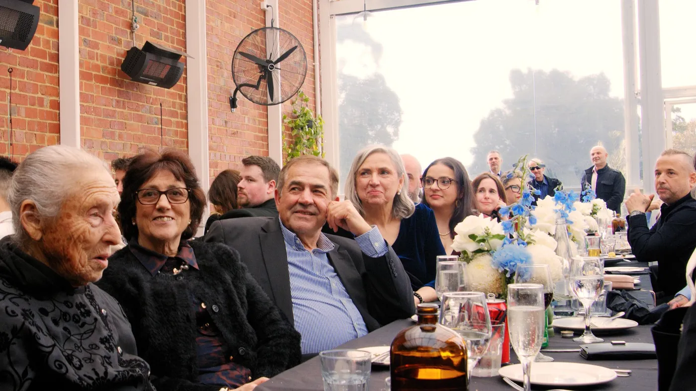 A group of guests seated together at an Olive Lane event