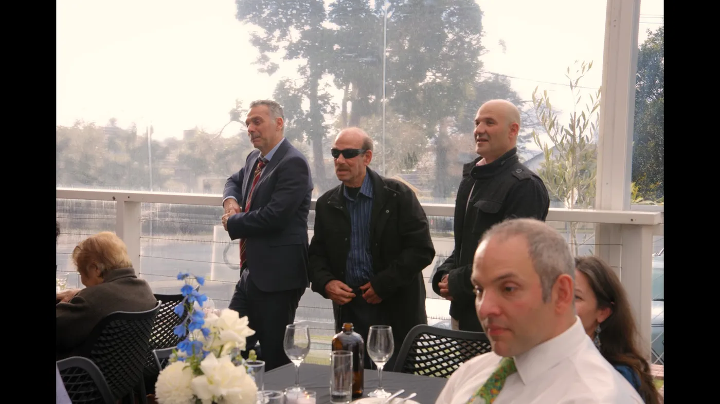 Guests standing together outside an Olive Lane event