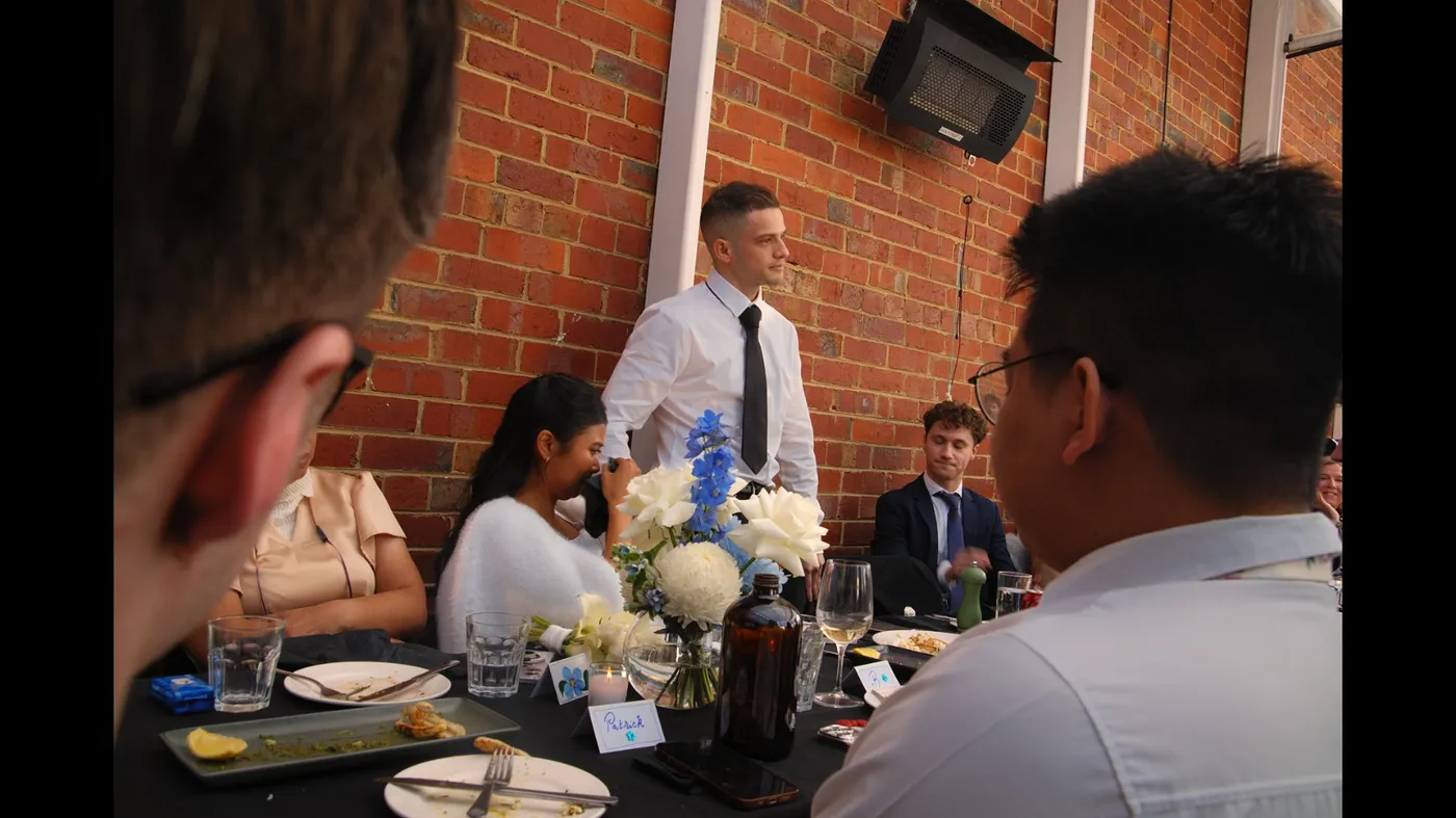 Guests seated at a long table during an Olive Lane event
