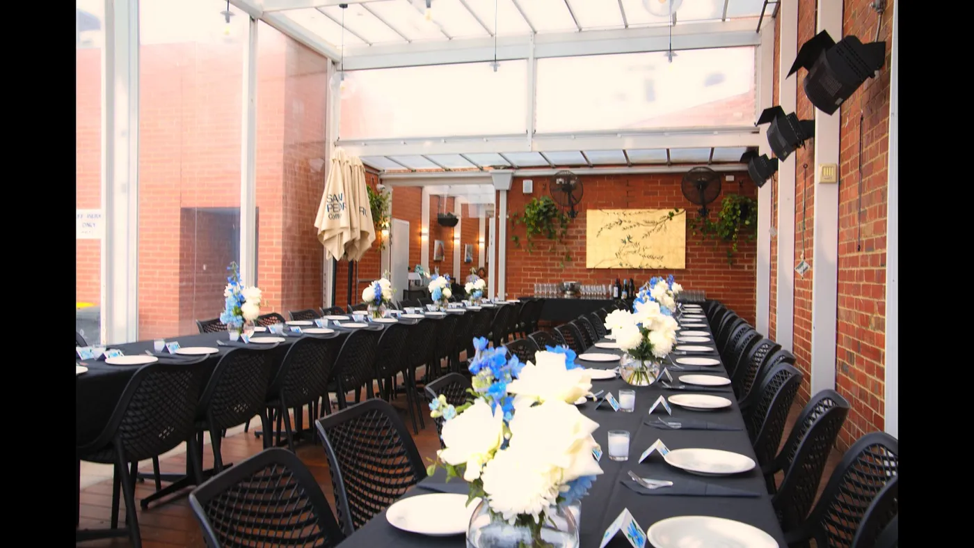 Long private event table set for a celebration dinner at Olive Lane